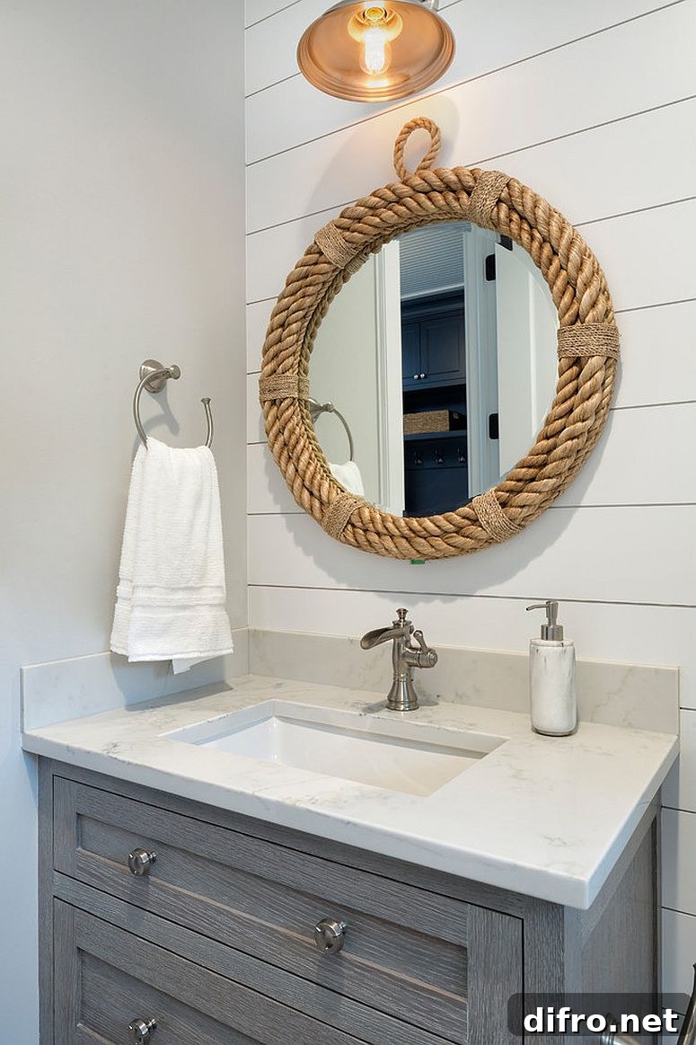 Rope framed mirror in coastal powder room