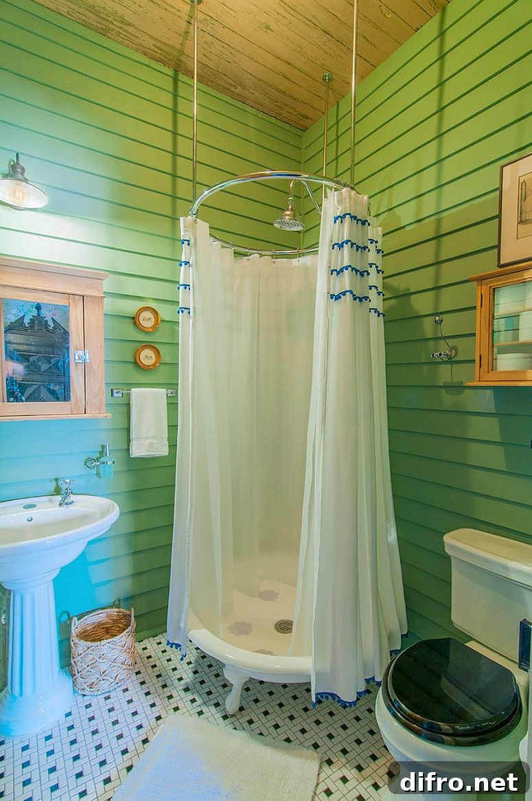 Eclectic green bathroom with an inventive shower zone