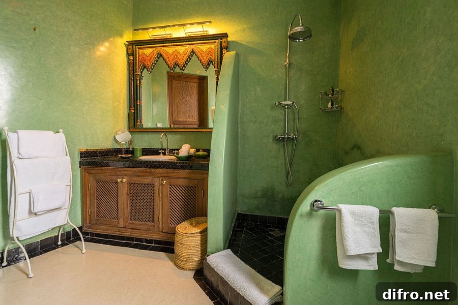 Textured green walls in a Mediterranean bathroom
