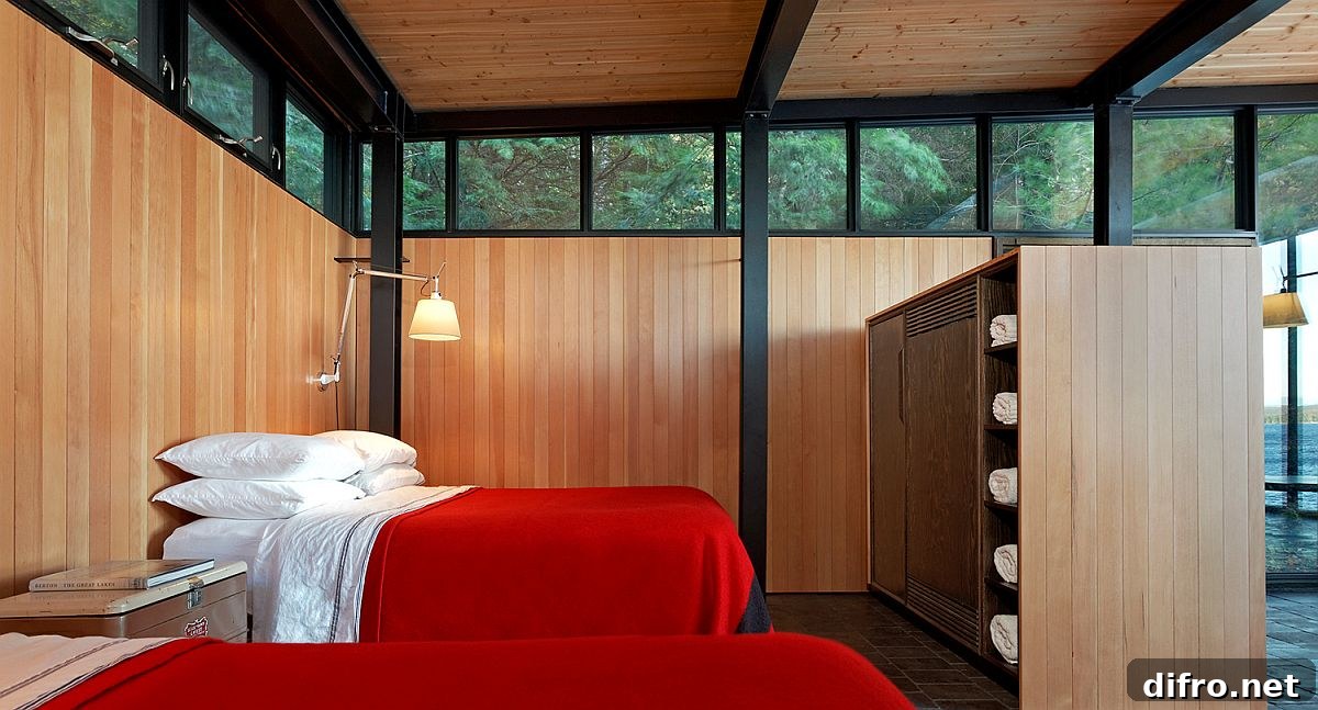 Relaxing and minimal bedroom of the boathouse with red bedding