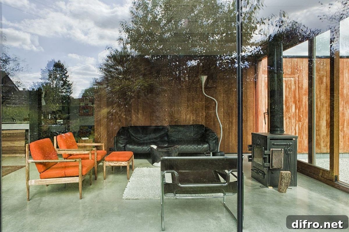 Small, simple living area with glass walls and comfortable decor