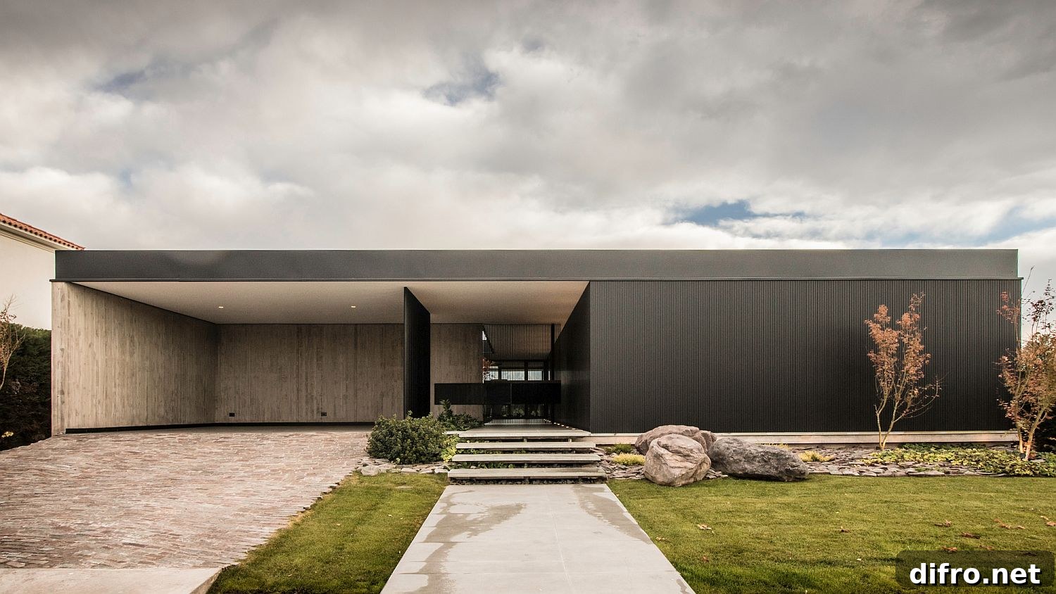 Street facade of the house combines privacy with modernity