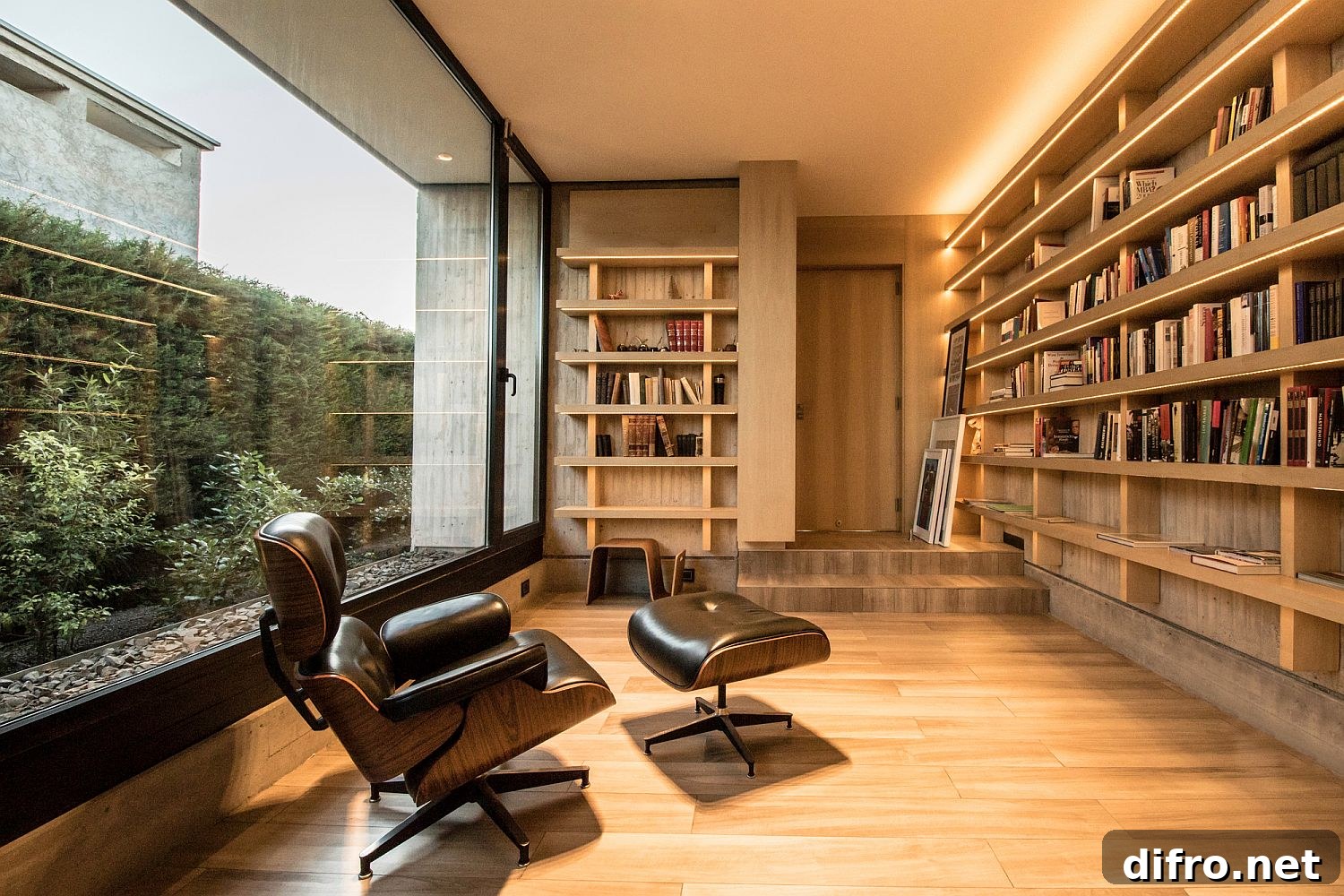 Reading room of the house with comfy Eames Lounger and woodsy interior
