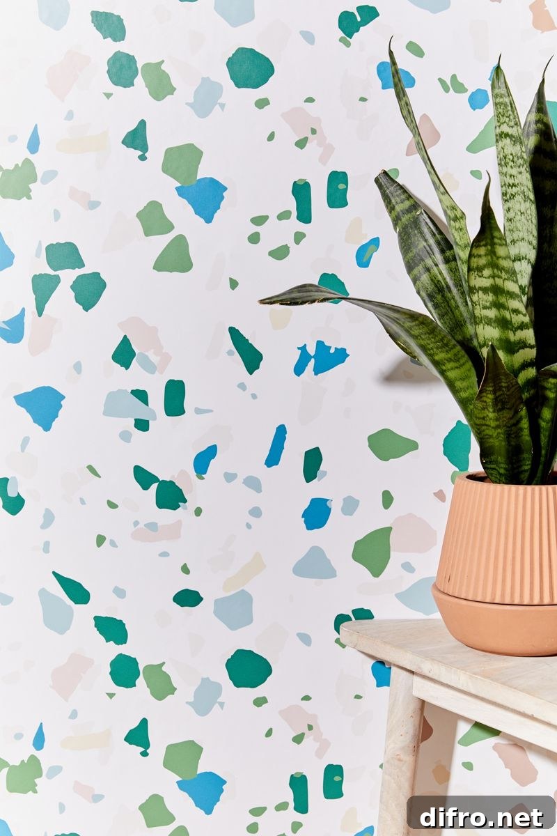 Removable terrazzo wallpaper in blues and greens