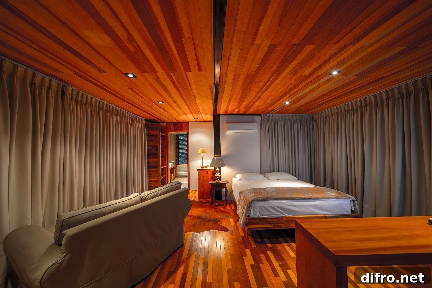 Cozy bedroom with gray drapes and wooden finish
