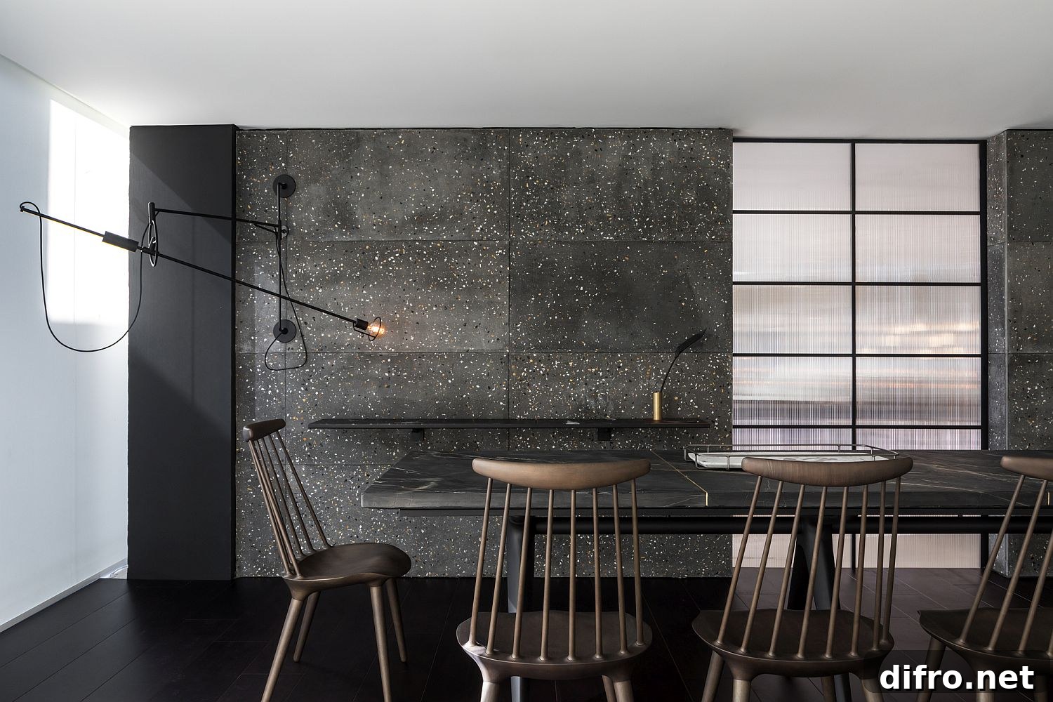 Dark and dashing backdrop of the dining room crafted using Tresuno’s concrete