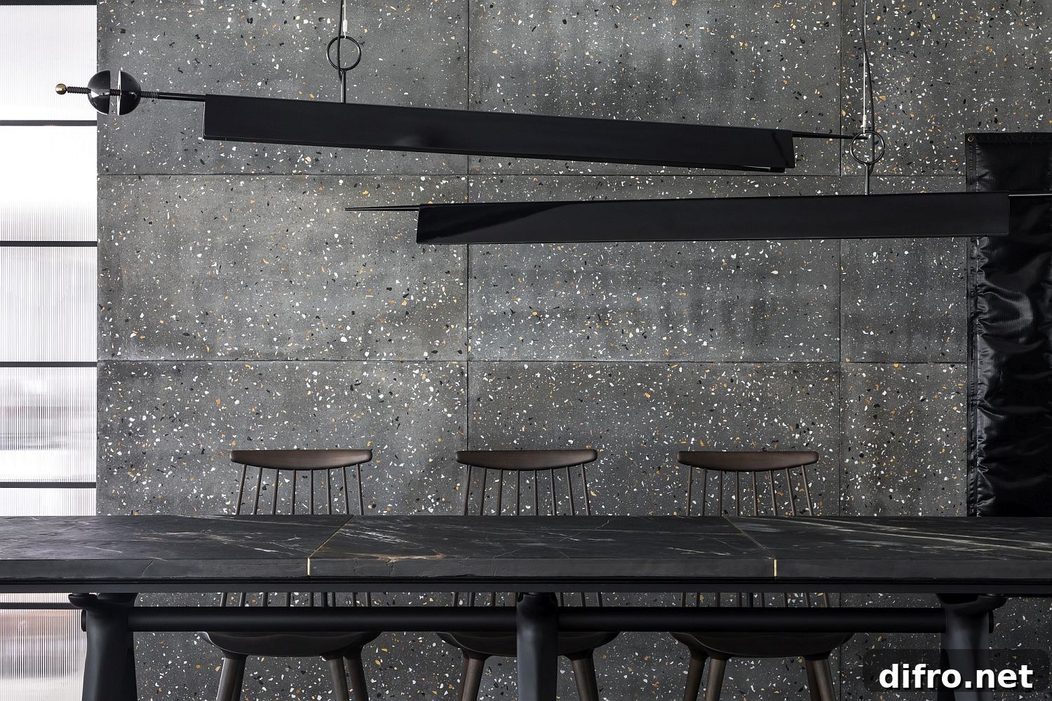 Minimal lighting fixtures add to the style of the dining area