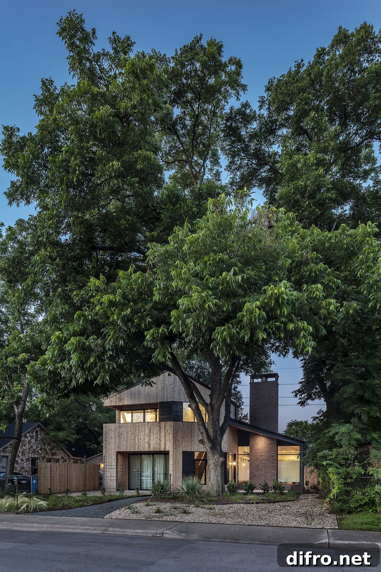 Trees around the house shape its facade and overall appeal