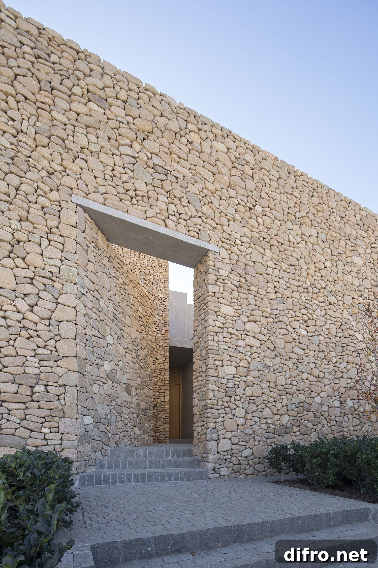 Perimeter stone walls providing privacy around Cerro la Cruz House
