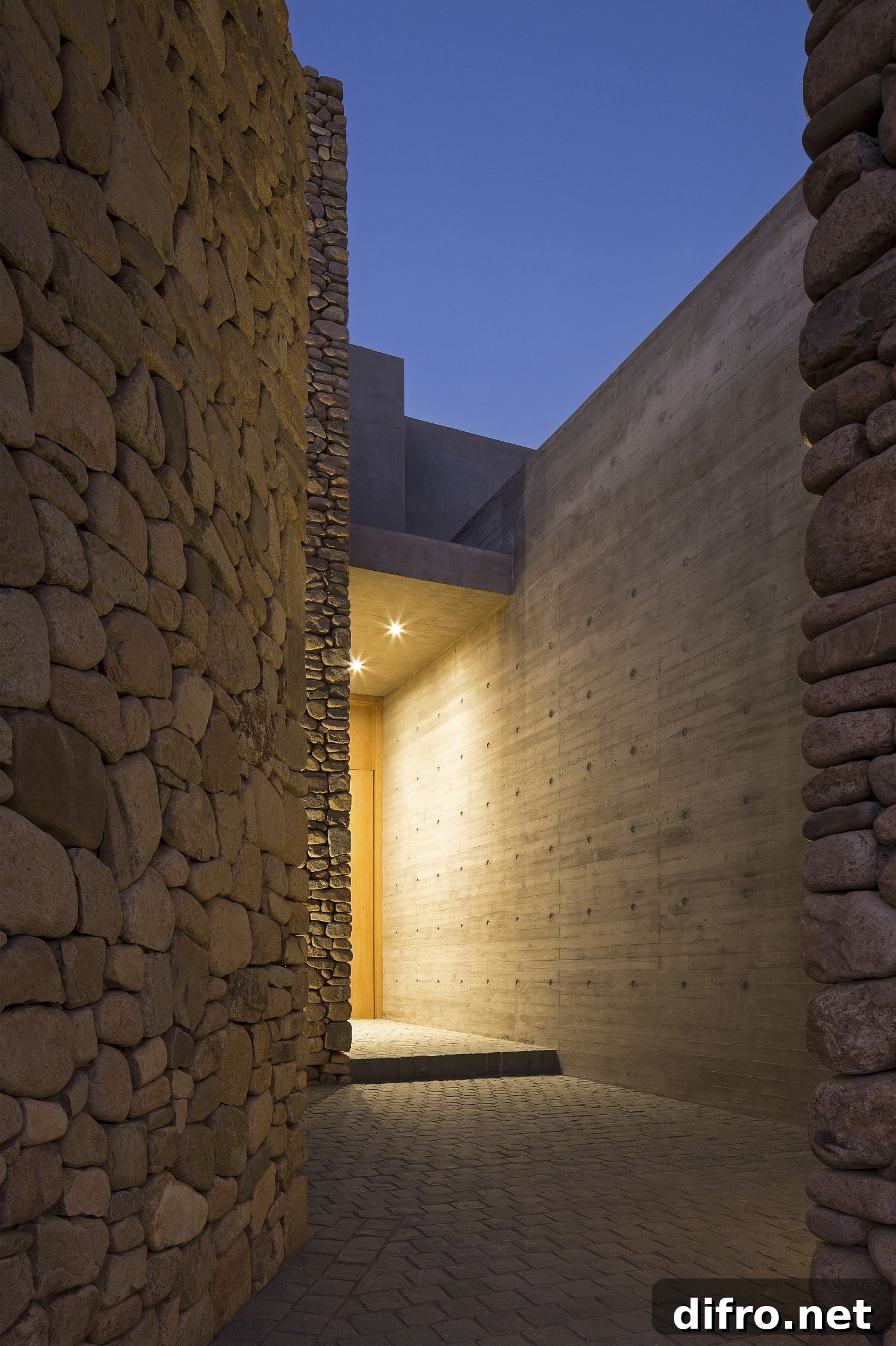 Wood, concrete and stone entrance of home in Lo Barnechea, Chile