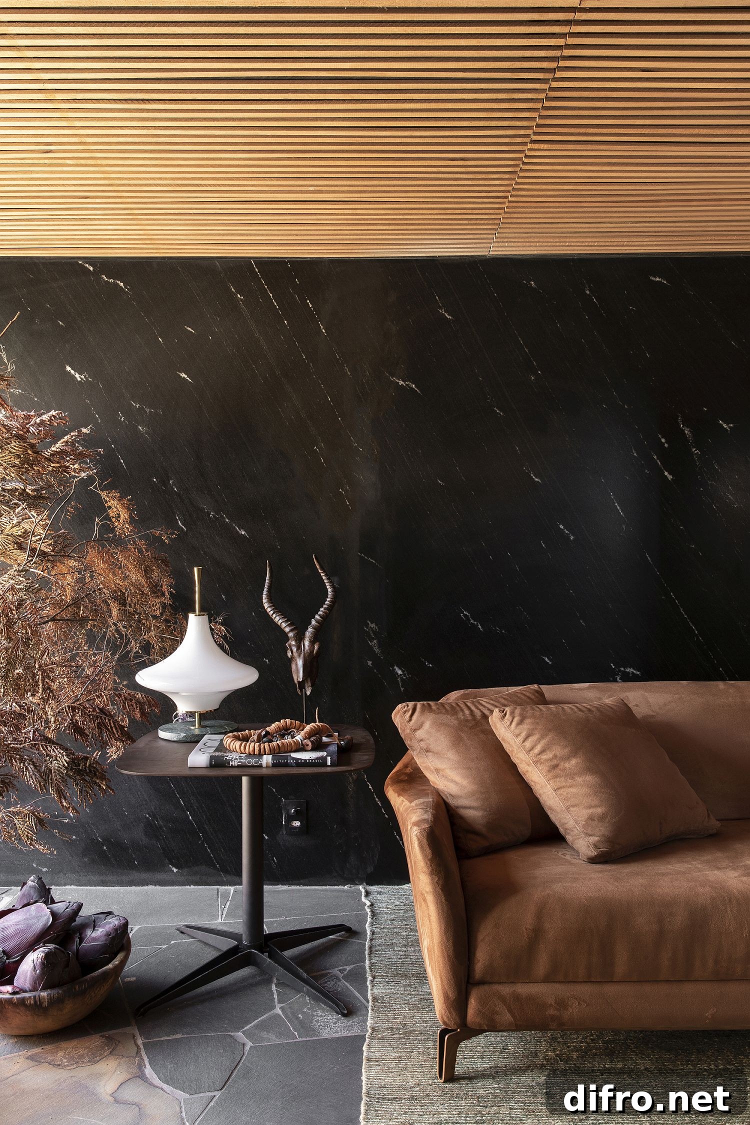 Polished living room with dark stone and wooden accents