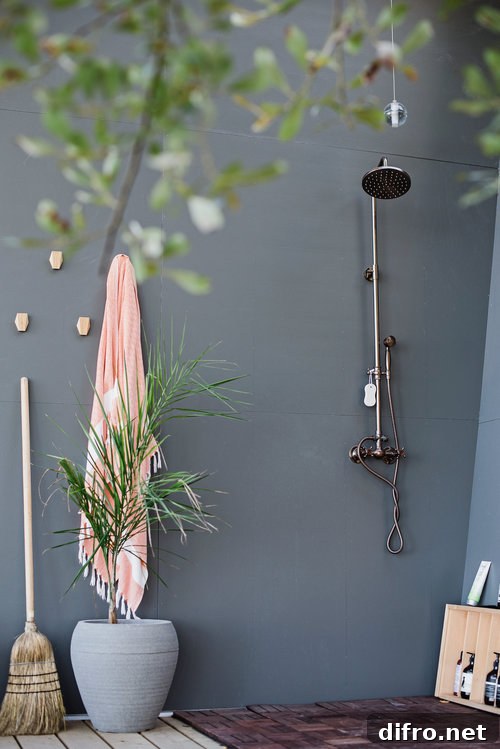 Bluish gray outdoor shower with greenery