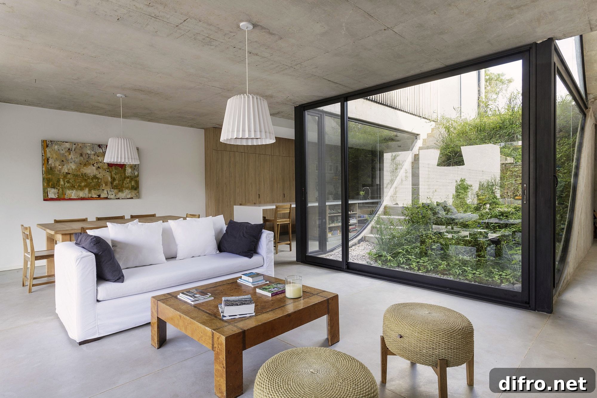 Living room of the house in white and wood with plenty of natural light flowing in