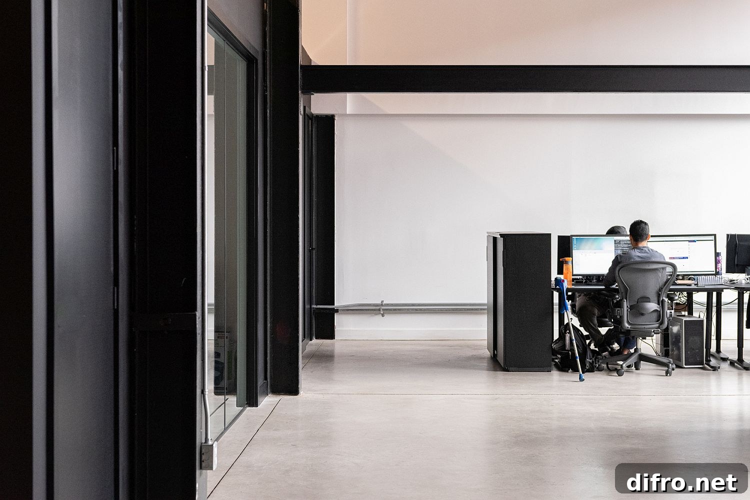 Black anchors the open plan office