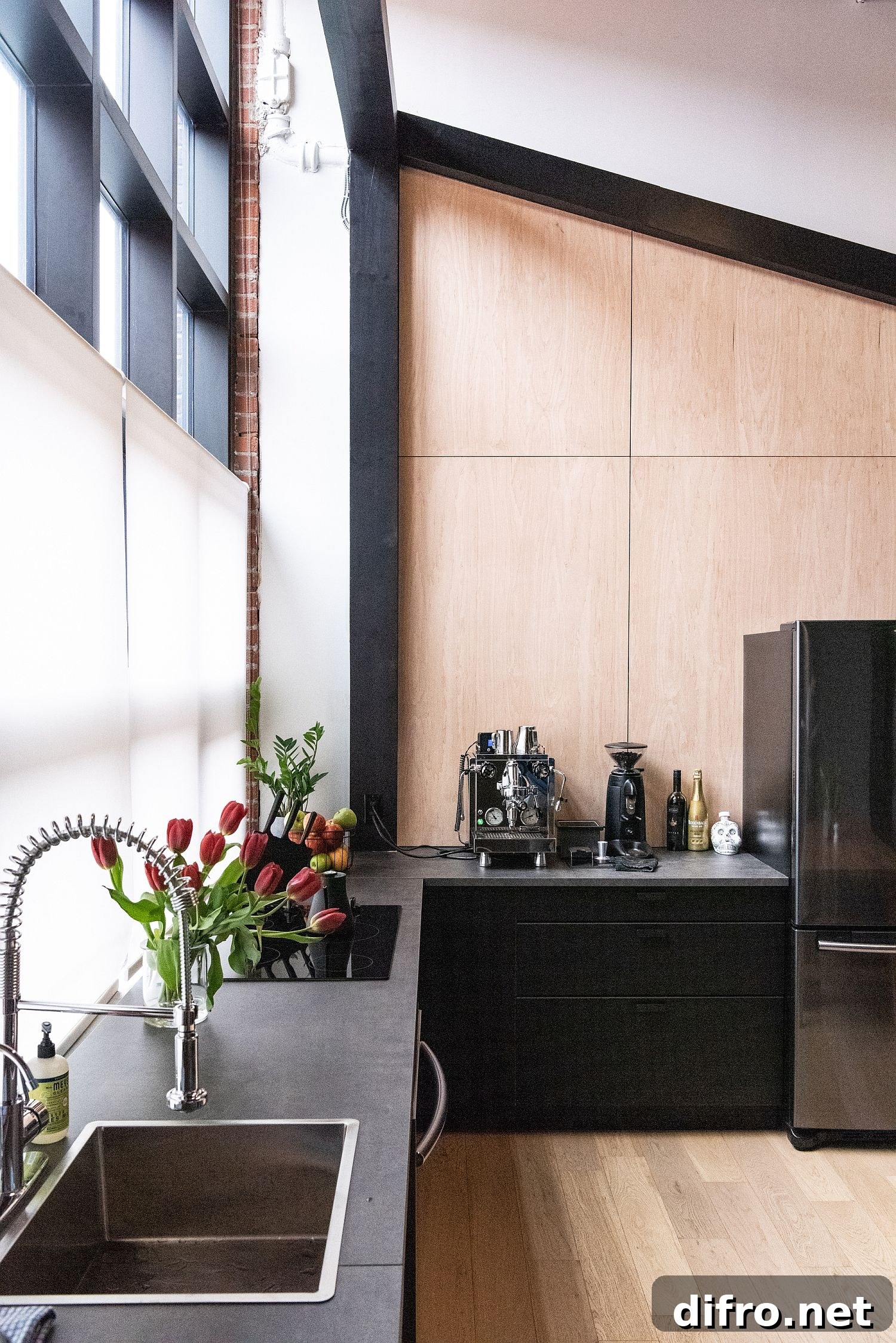 Wood and black kitchen with natural light