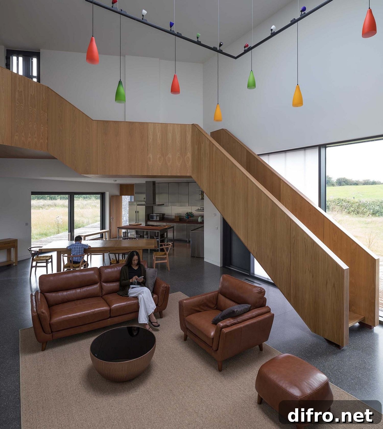 Living room of the house illuminated using colorful pendants