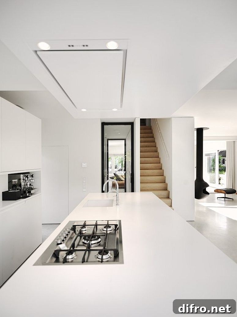 White kitchen in the modernized A-frame home