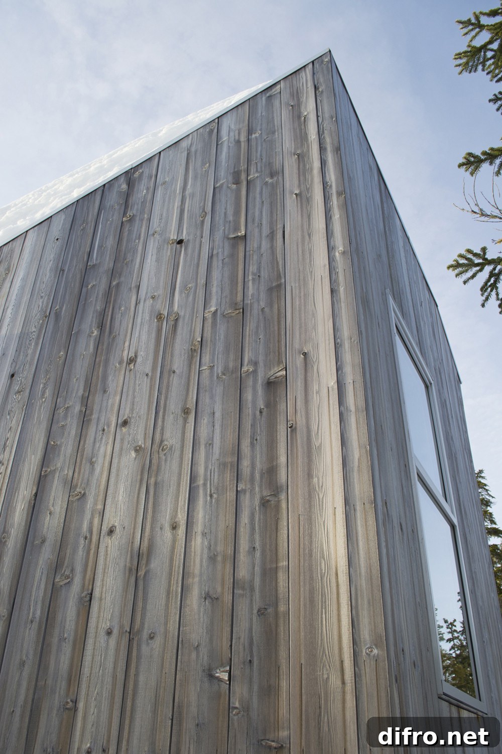 Cedar-clad exterior of the small Alpine Cabin