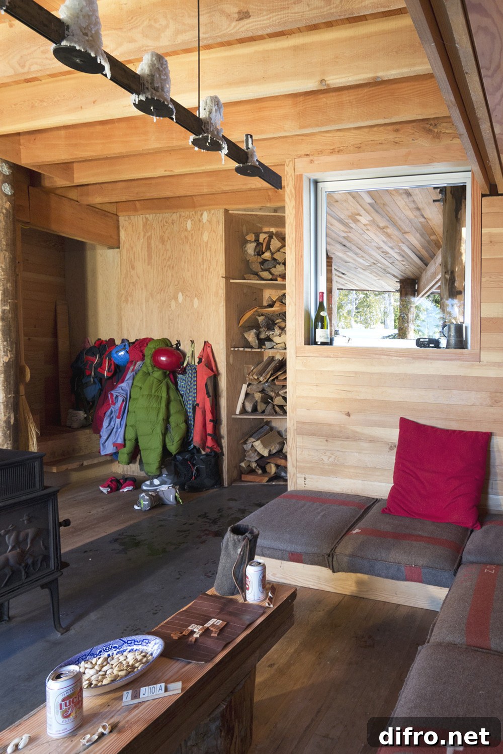 Mudroom and living area of the Alpine Cabin with wooden interiors