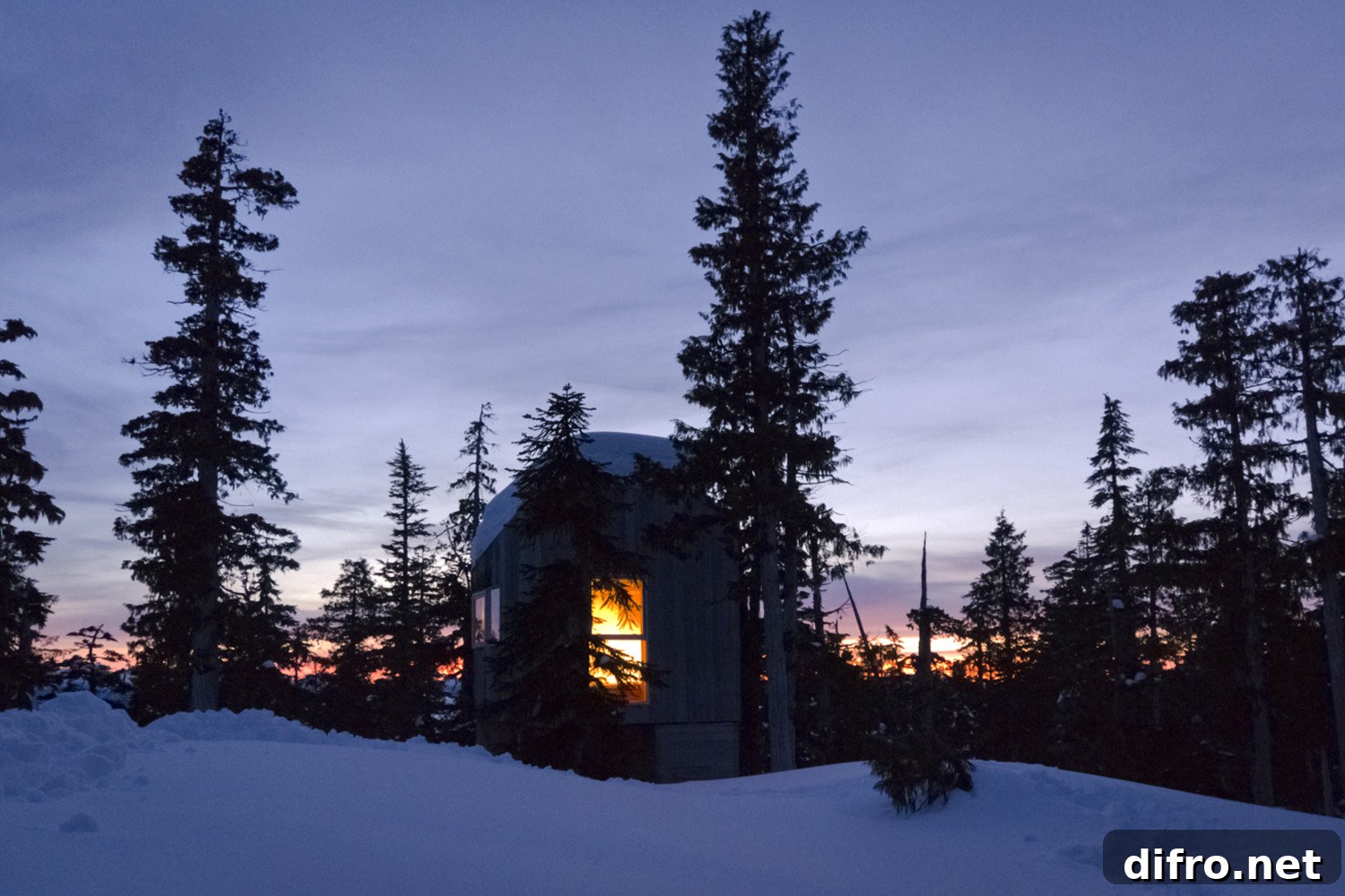 Alpine Cabin illuminated after sunset