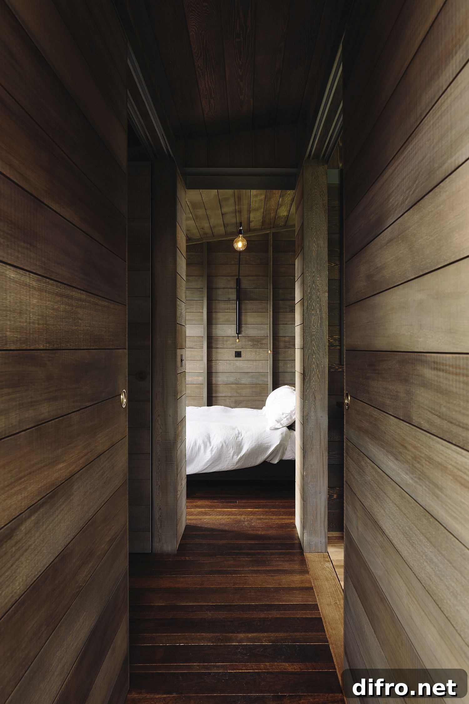 Corridor leading to the bedroom in the woodsy cabin