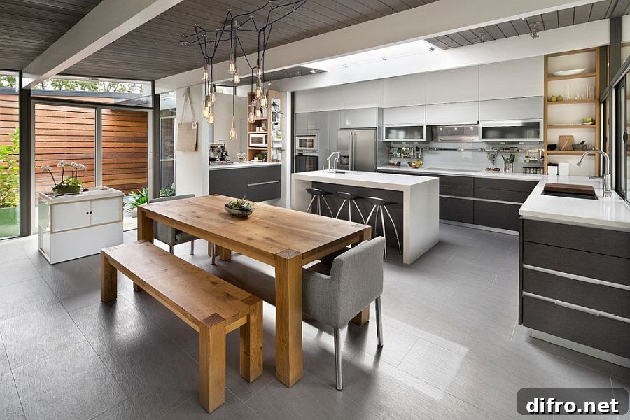Gray kitchen with natural wood dining table