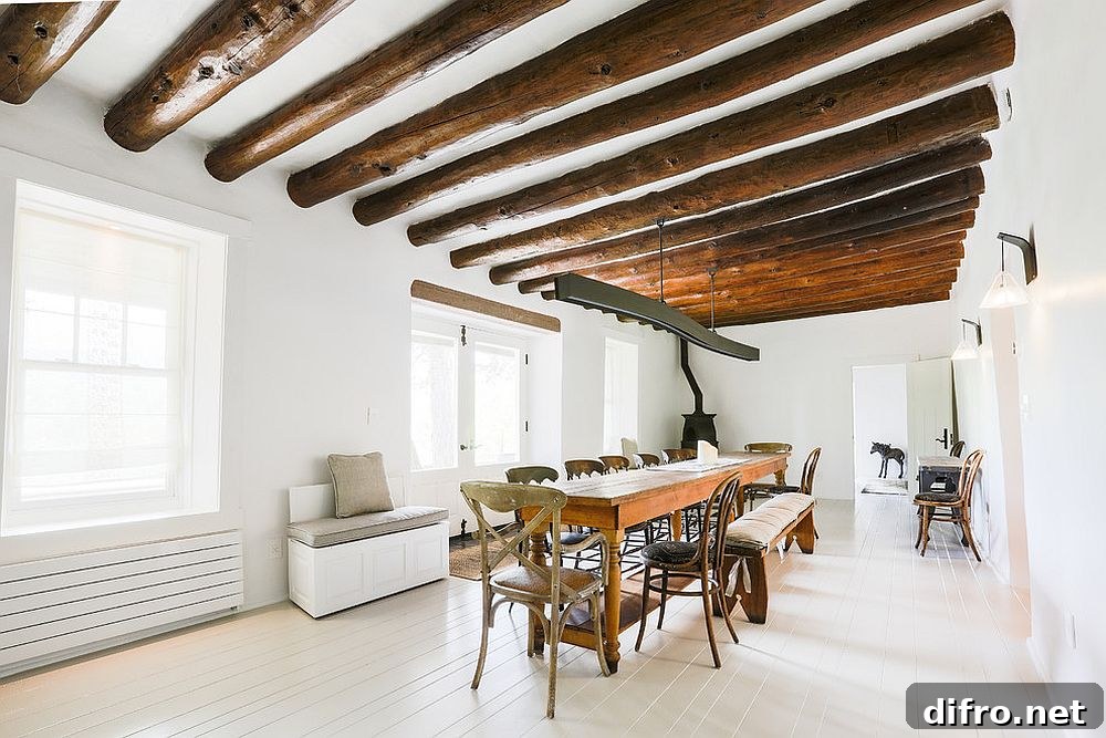 Majestic white and wood dining room with ceiling beams