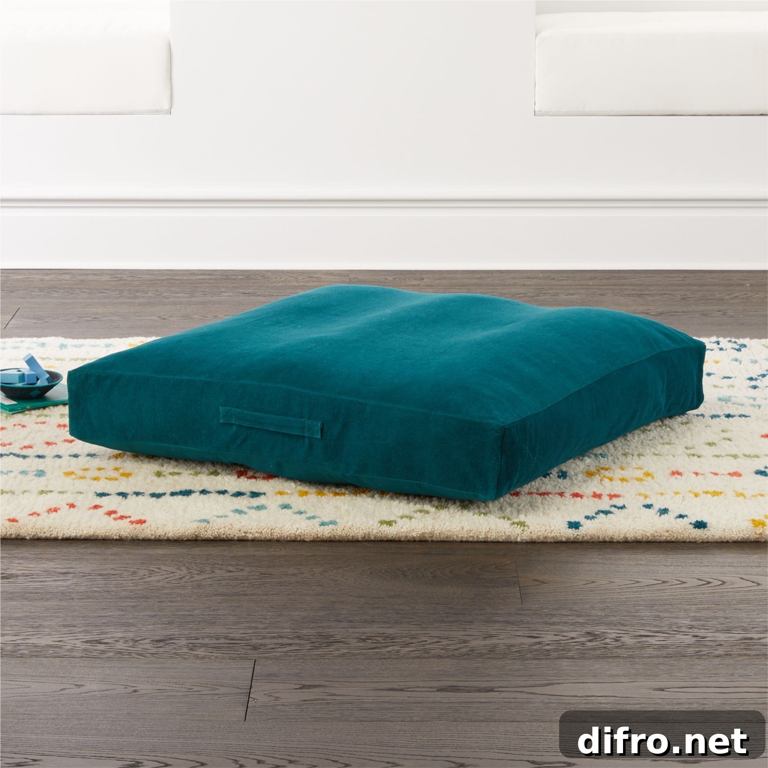 Teal floor cushion in kids' room