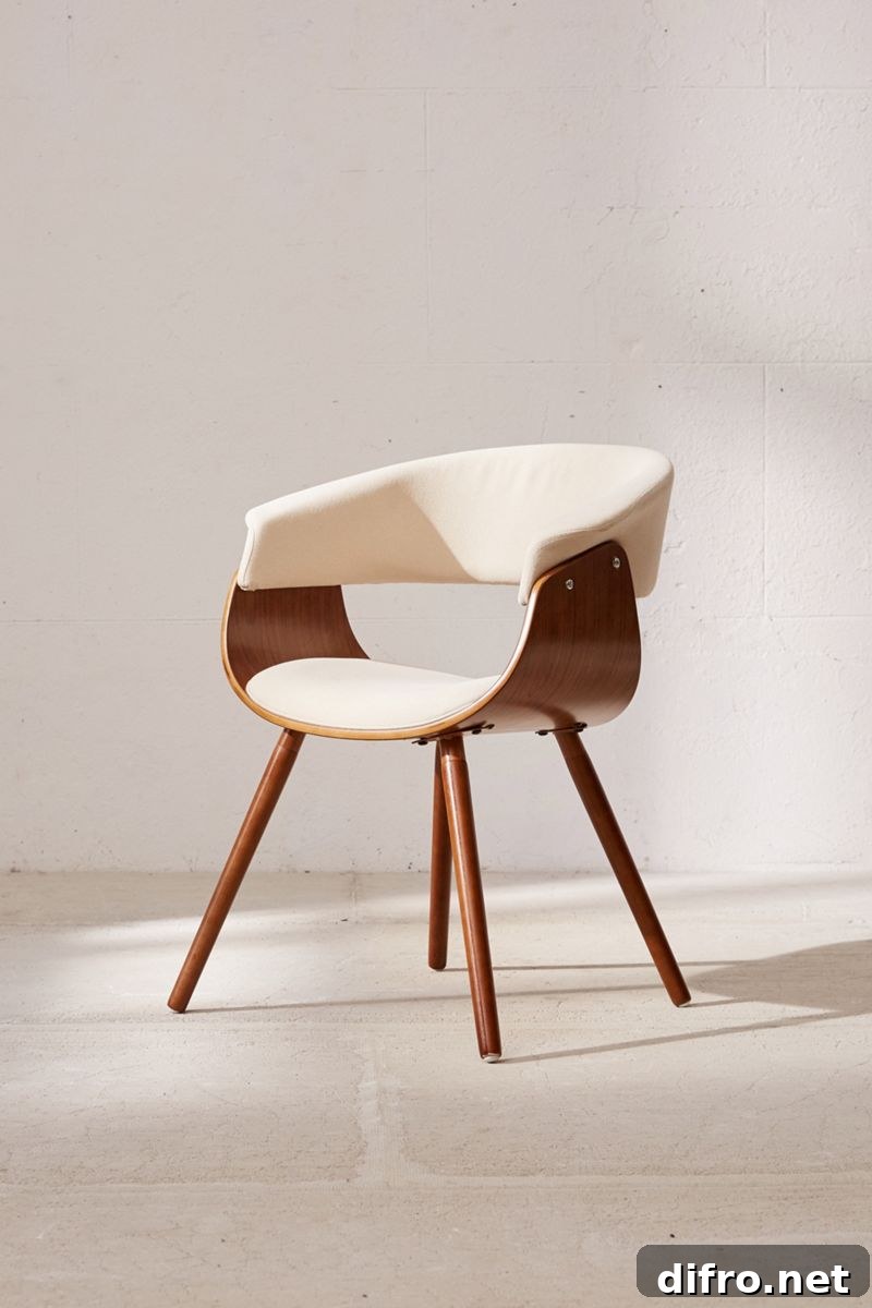Mid-century inspired wooden chair with curved frame and upholstered seat