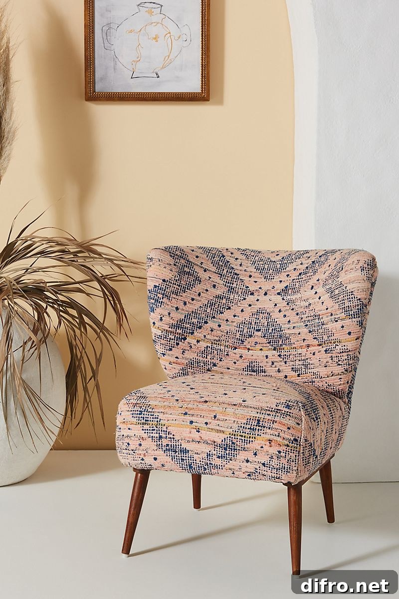 Rug-printed petite accent chair with acacia wooden frame and patterned upholstery