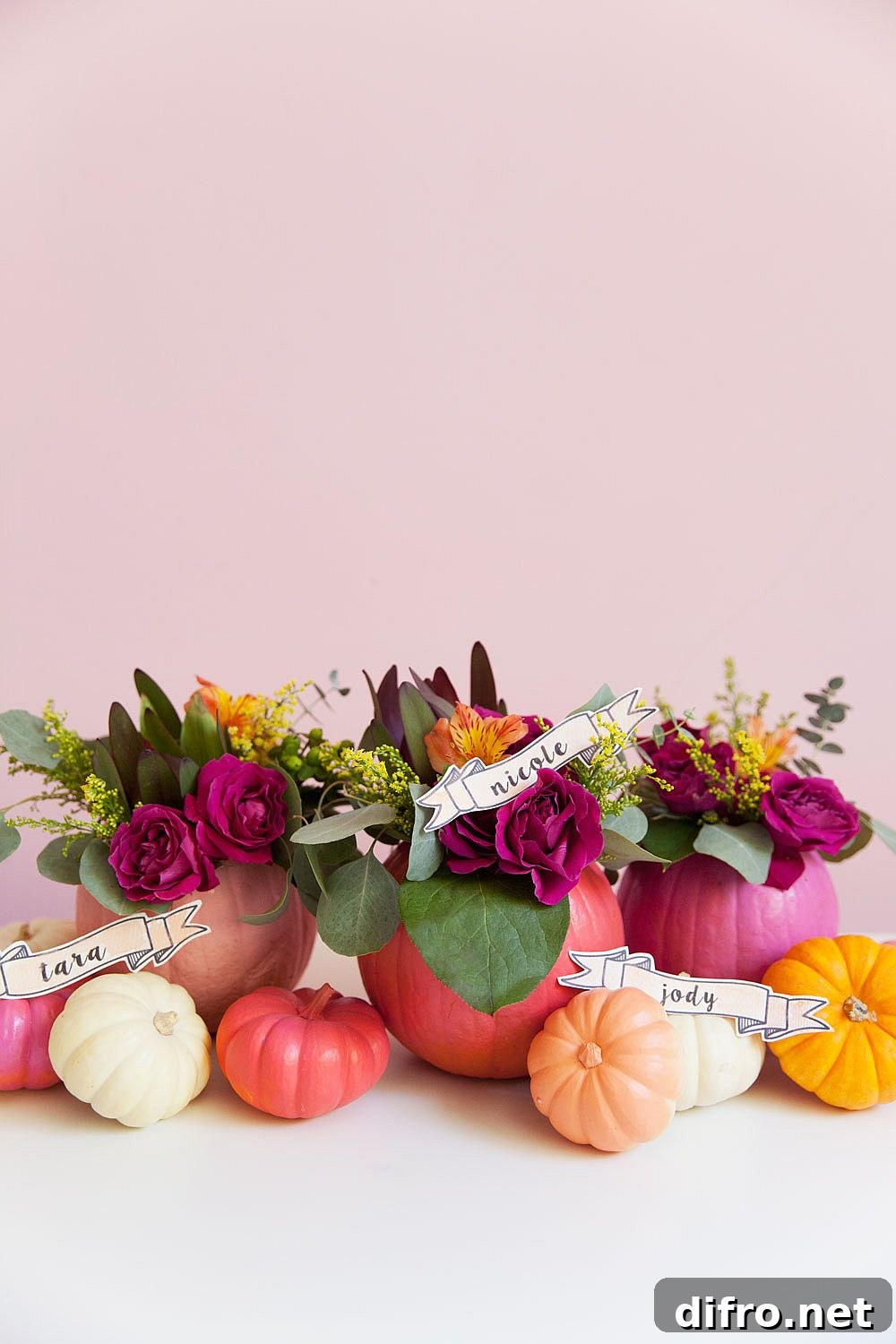 Colorful pumpkins and flowers brought together beautifully for fall charm