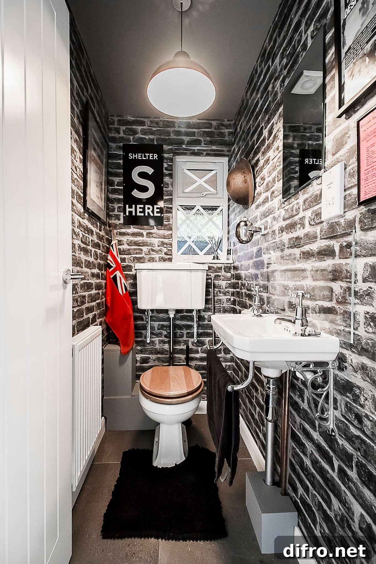 Small bathroom transformed by brick wallpaper