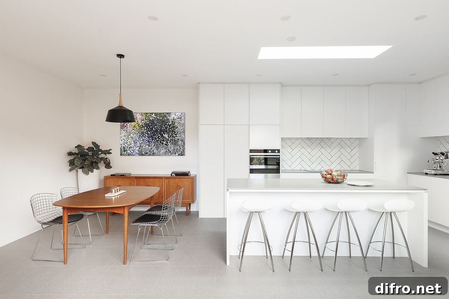 White kitchen with wooden dining table