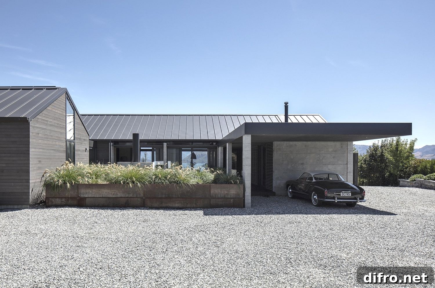 Thermomass panels, Corten steel and smoked carbon stained timber exterior of the New Zealand house