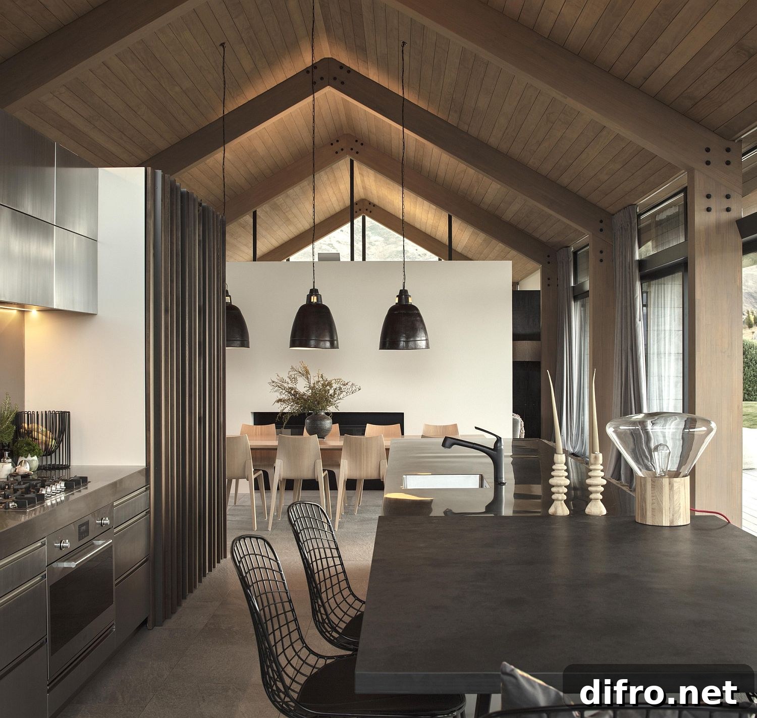 Oversized pendants in black accentuate the gabled roof of the house