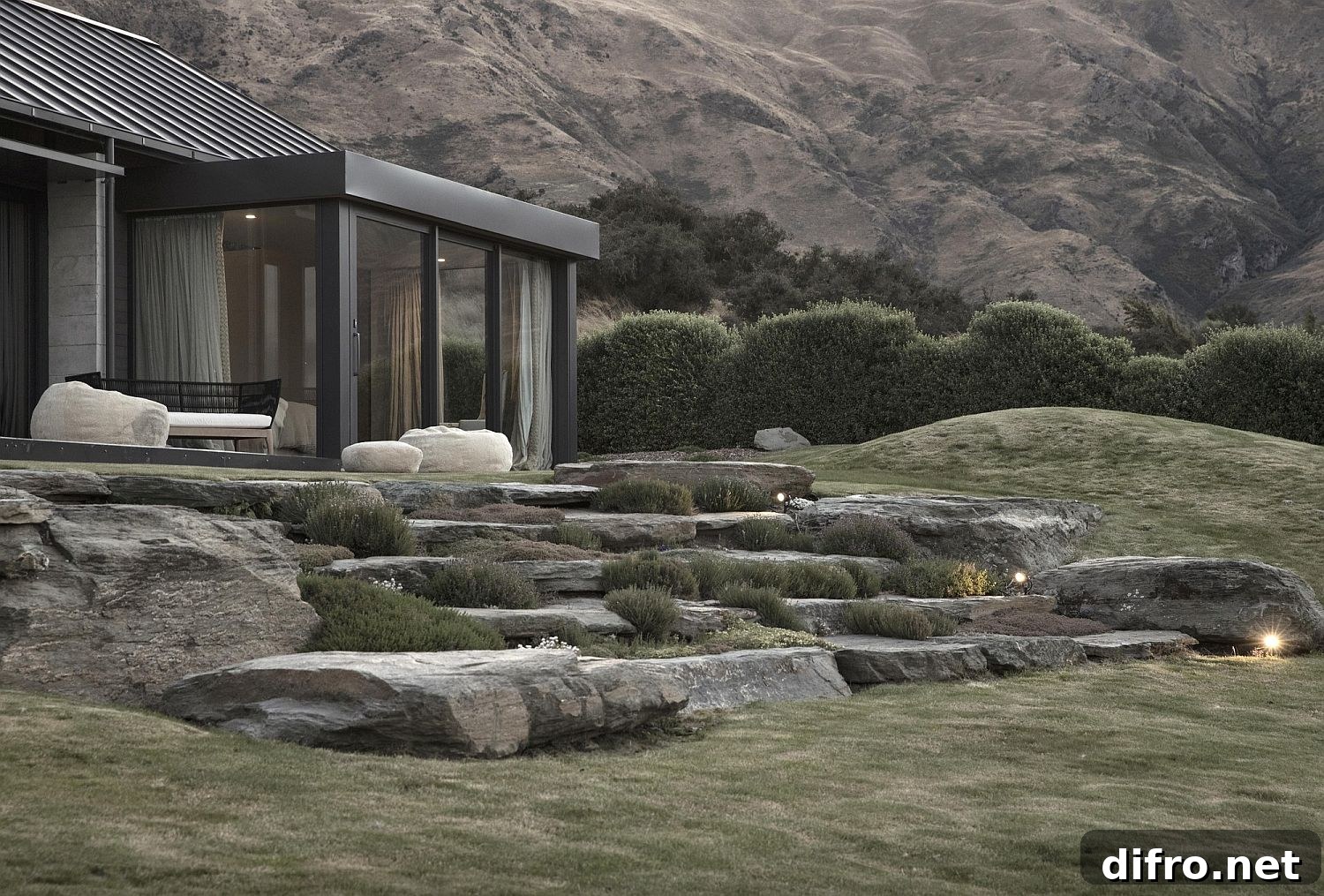 Sustainable house in New Zealand with glass walls and gabled roof