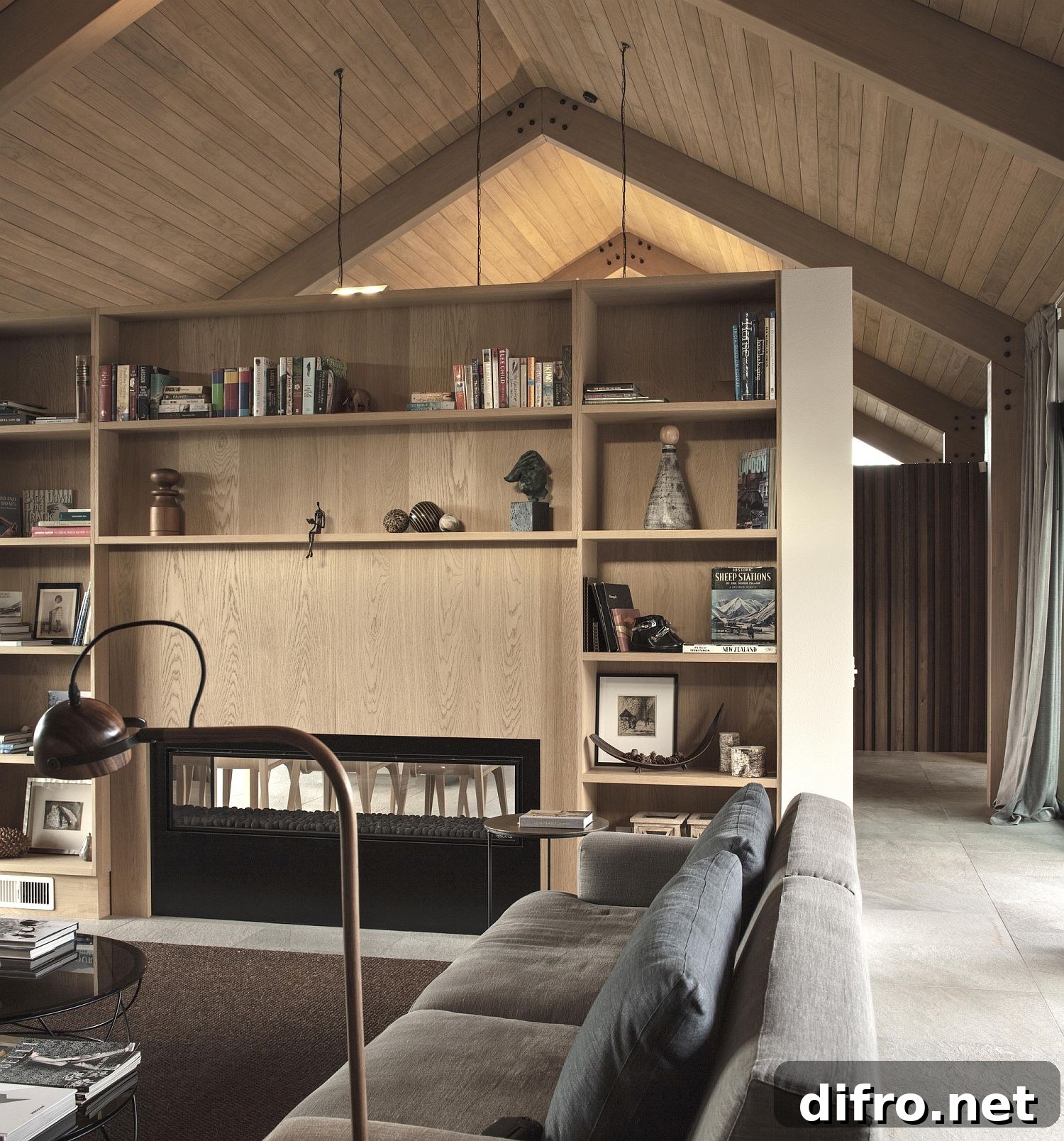 Bookshelves anchor the living room while adding color and accent features