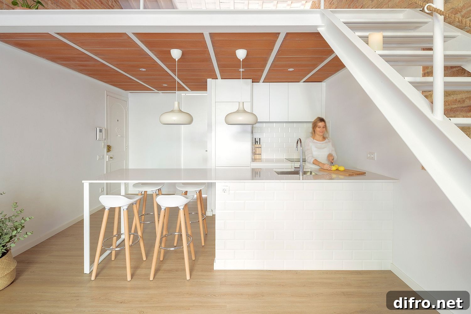 Bar stools in wood and white complement the overall appeal of the kitchen