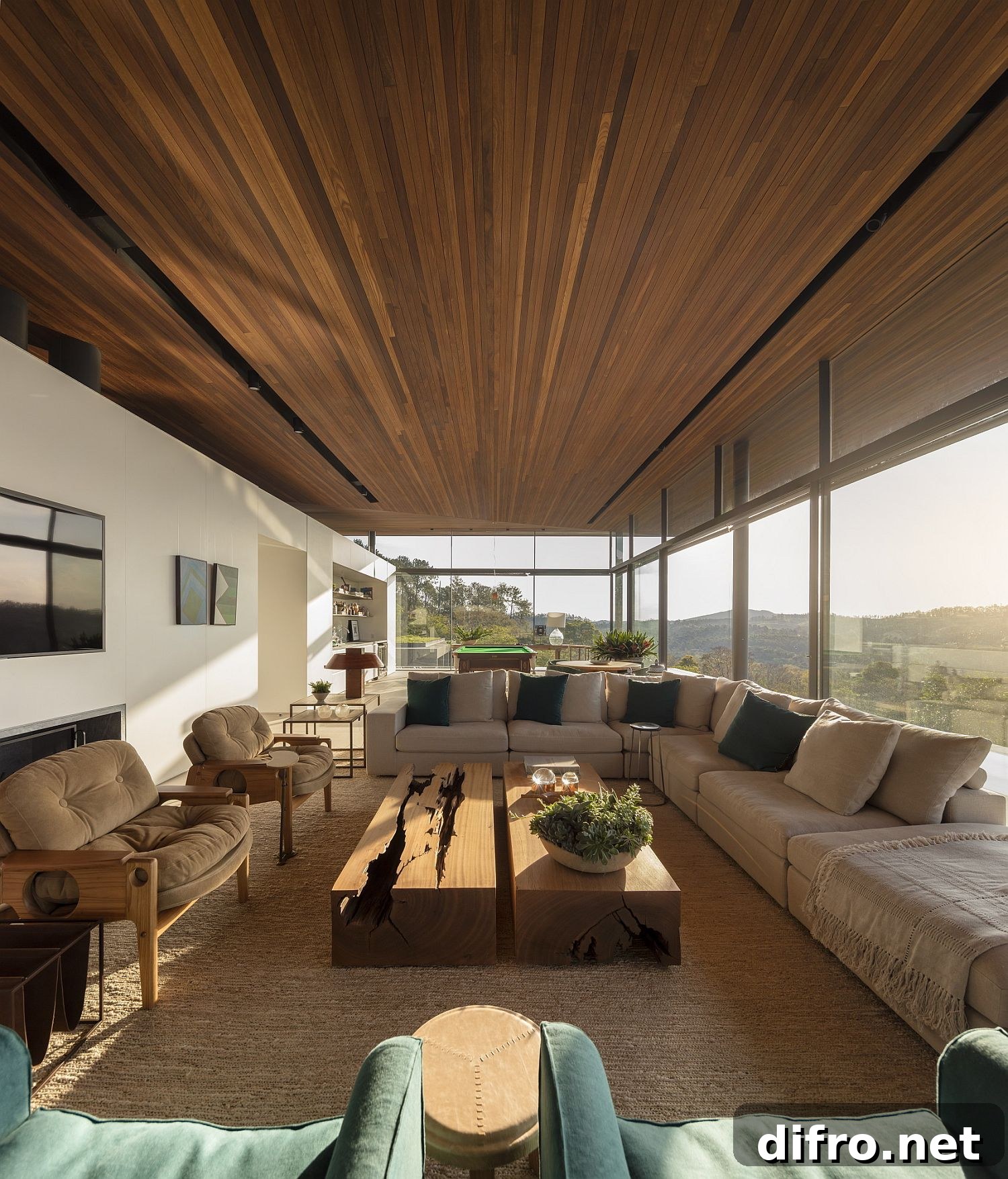 Family room with glass walls and wooden ceiling