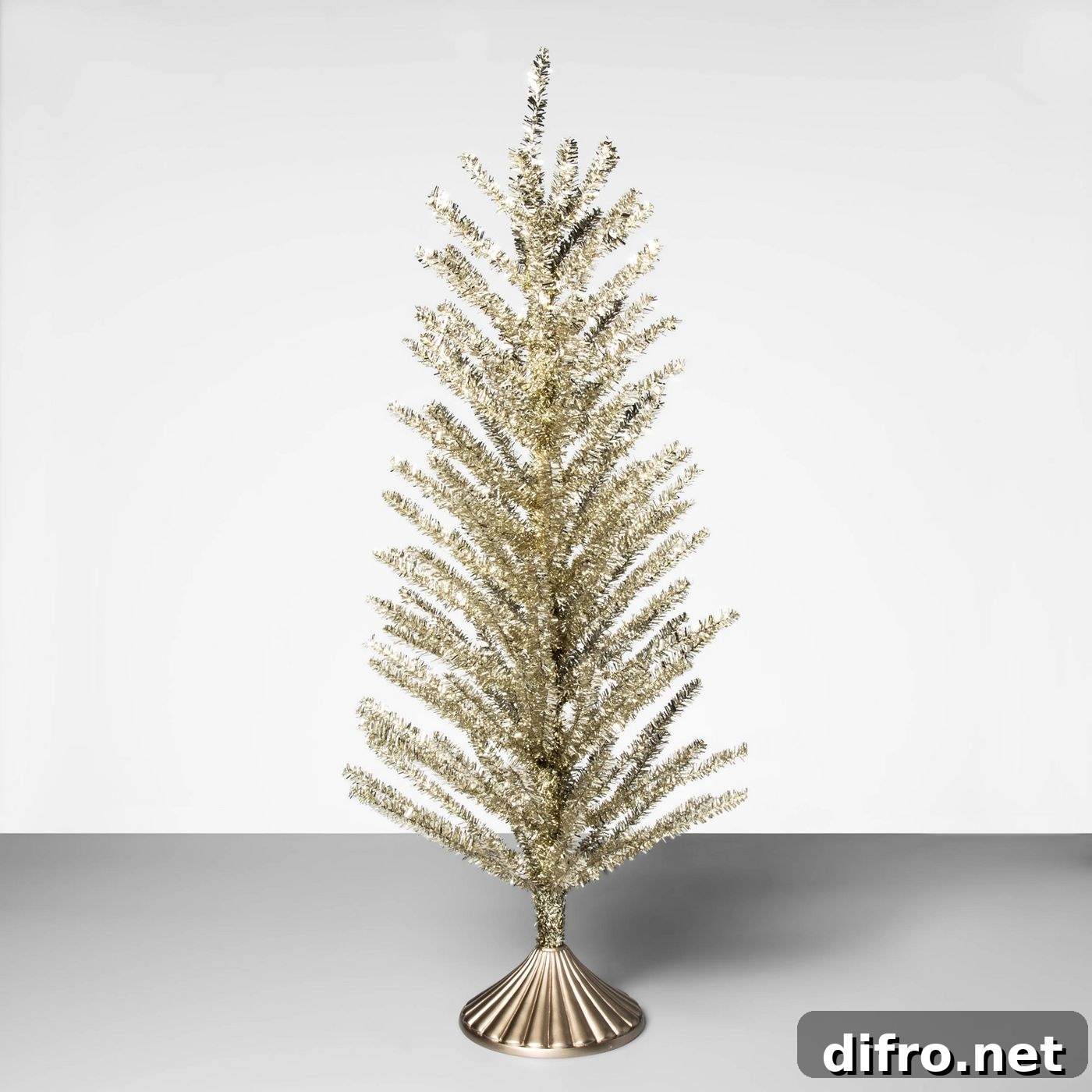 Small gold tinsel freestanding tree