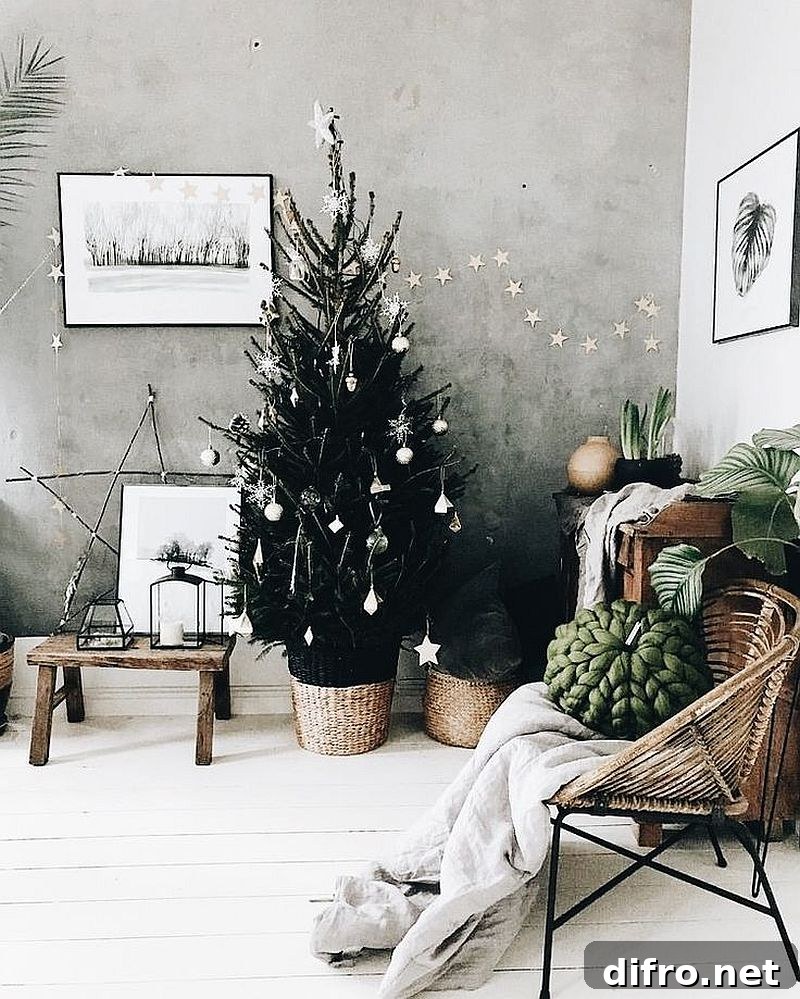 Black Christmas tree with silver decorations.