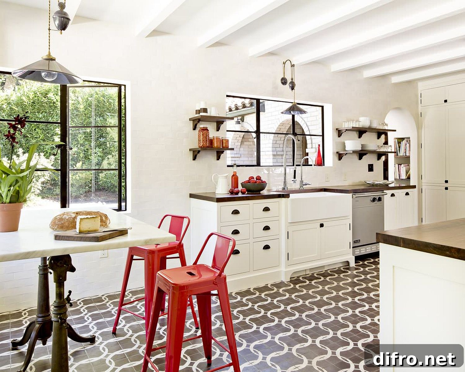 Mediterranean kitchen with red bar chairs