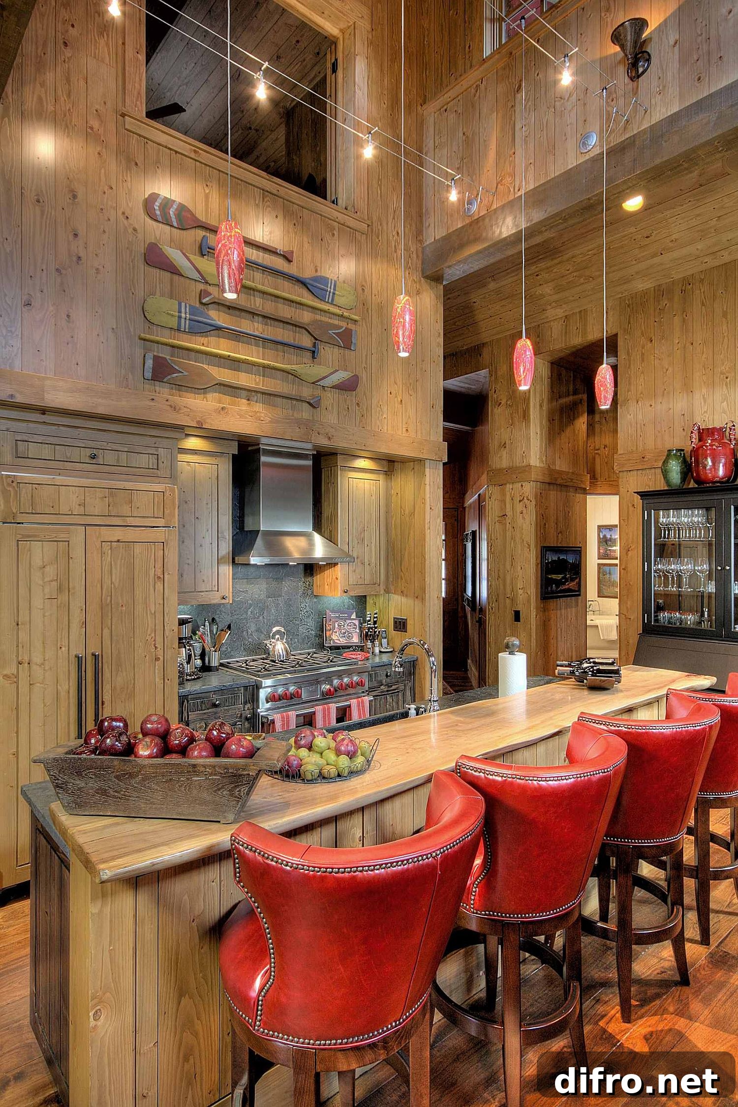 Rustic kitchen with red bar stools