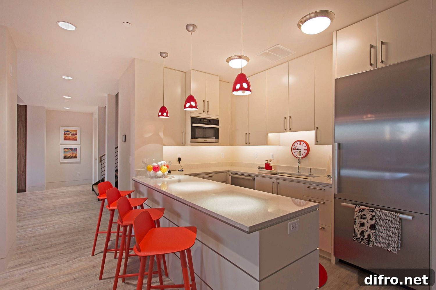 Geometric red bar stools with pendant lights