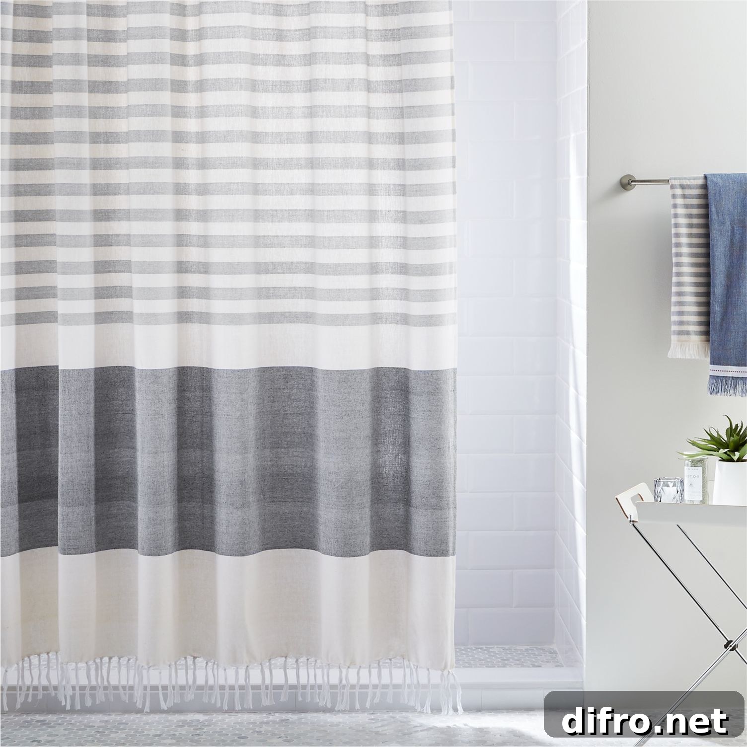 Tasseled shower curtain with grey stripes