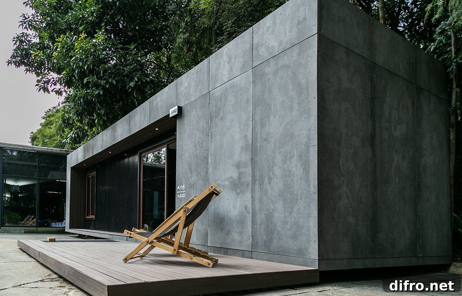 Small wooden deck outside the prefab provides an outdoor refuge