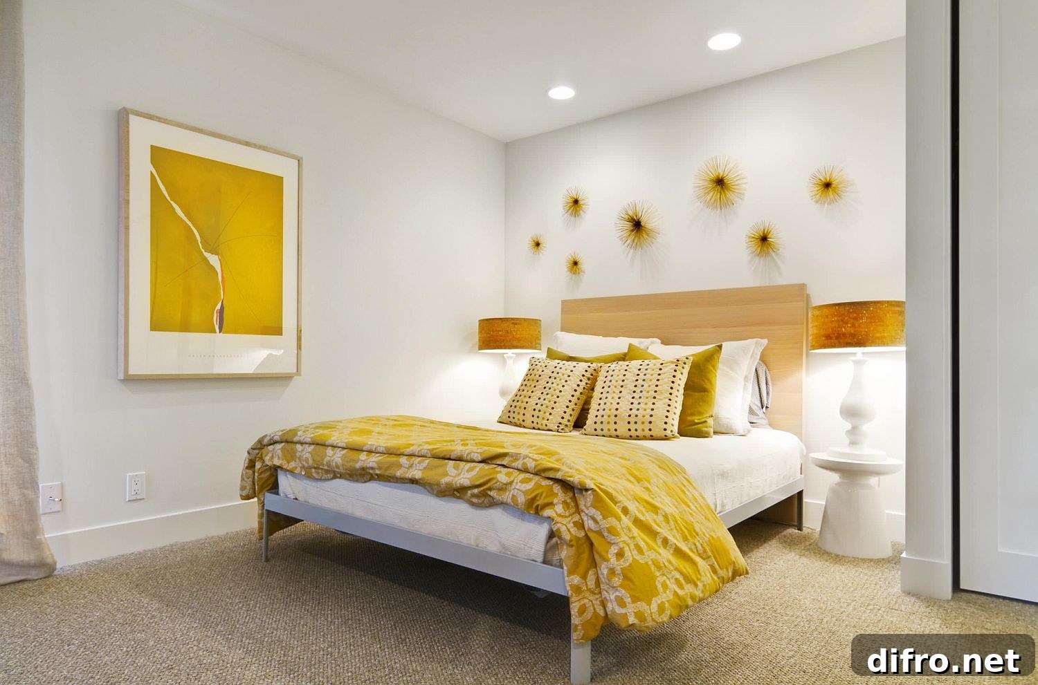 Modern bedroom with elegant gold and yellow accents highlighted by wall art