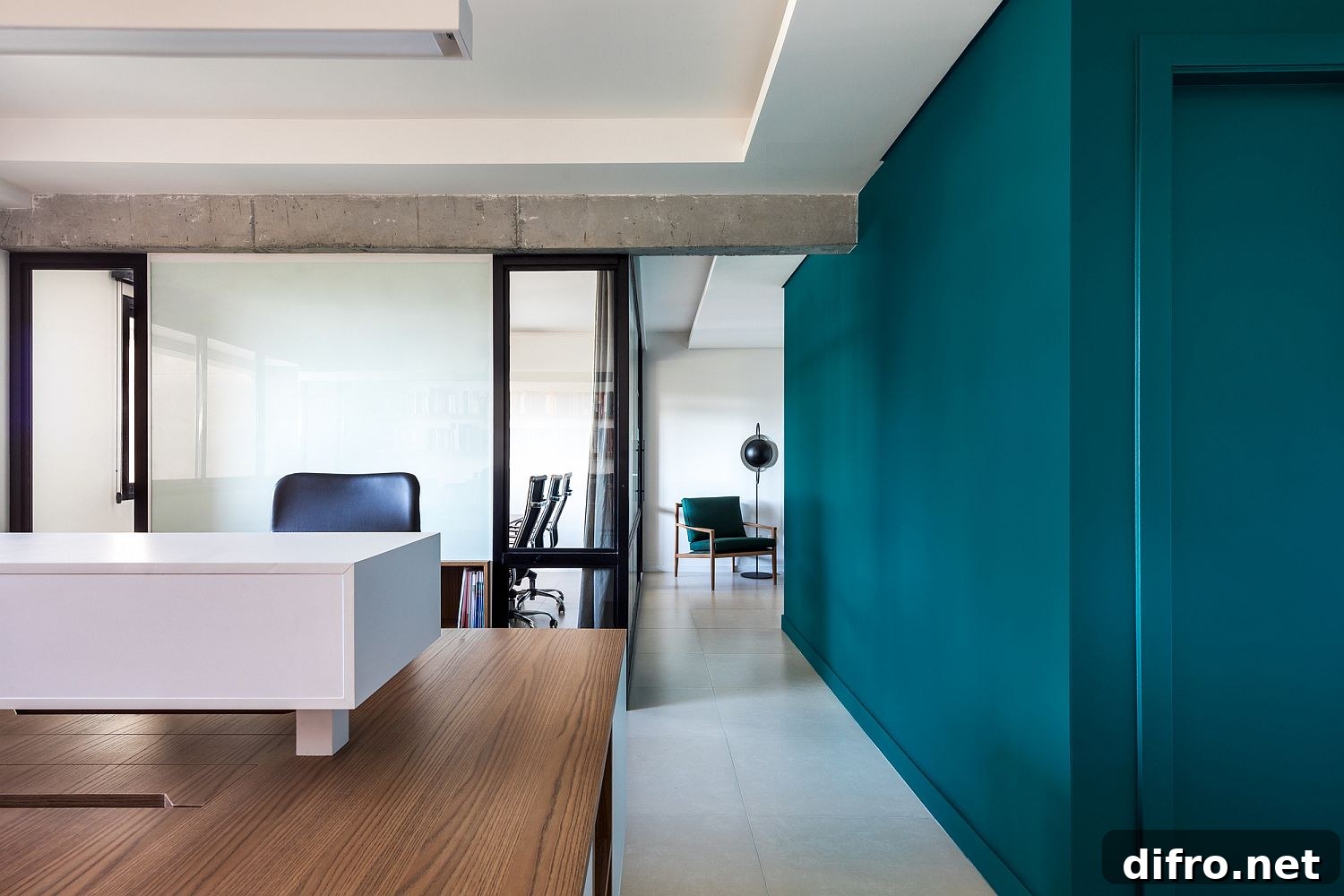 Porcelain flooring, wood and white walls and engaging green accents inside the office