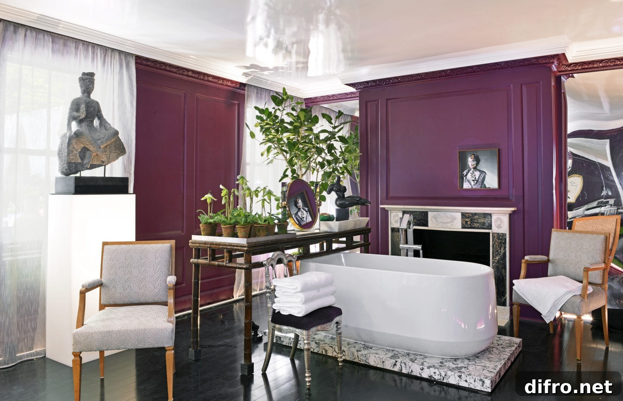 Bathroom painted in dark burgundy with sheer white drapes