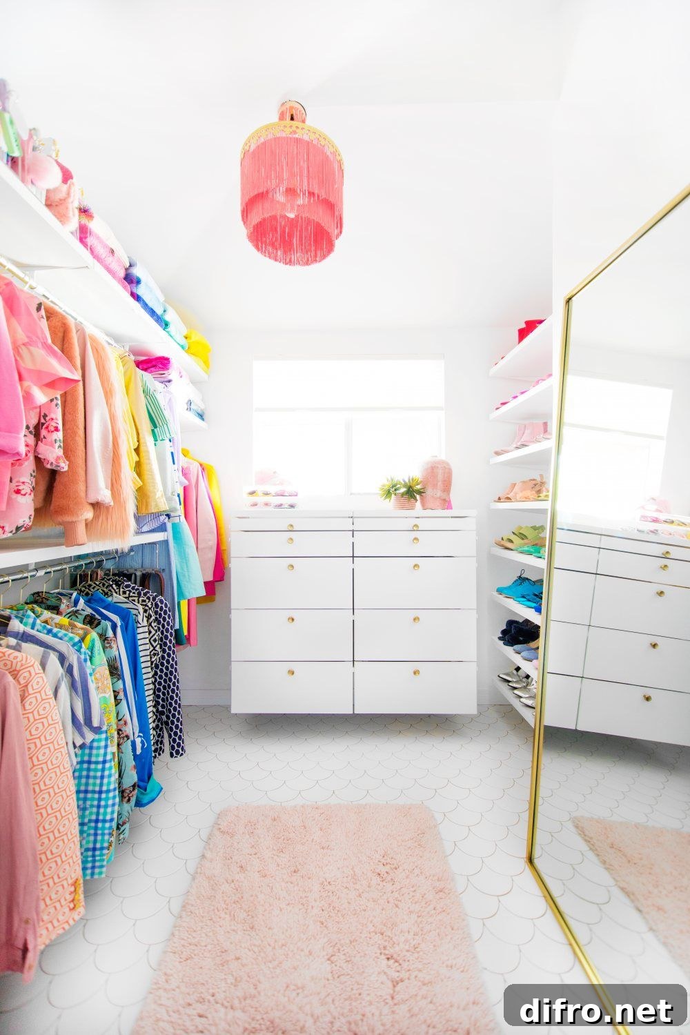 Bright master closet with white scalloped floor tile